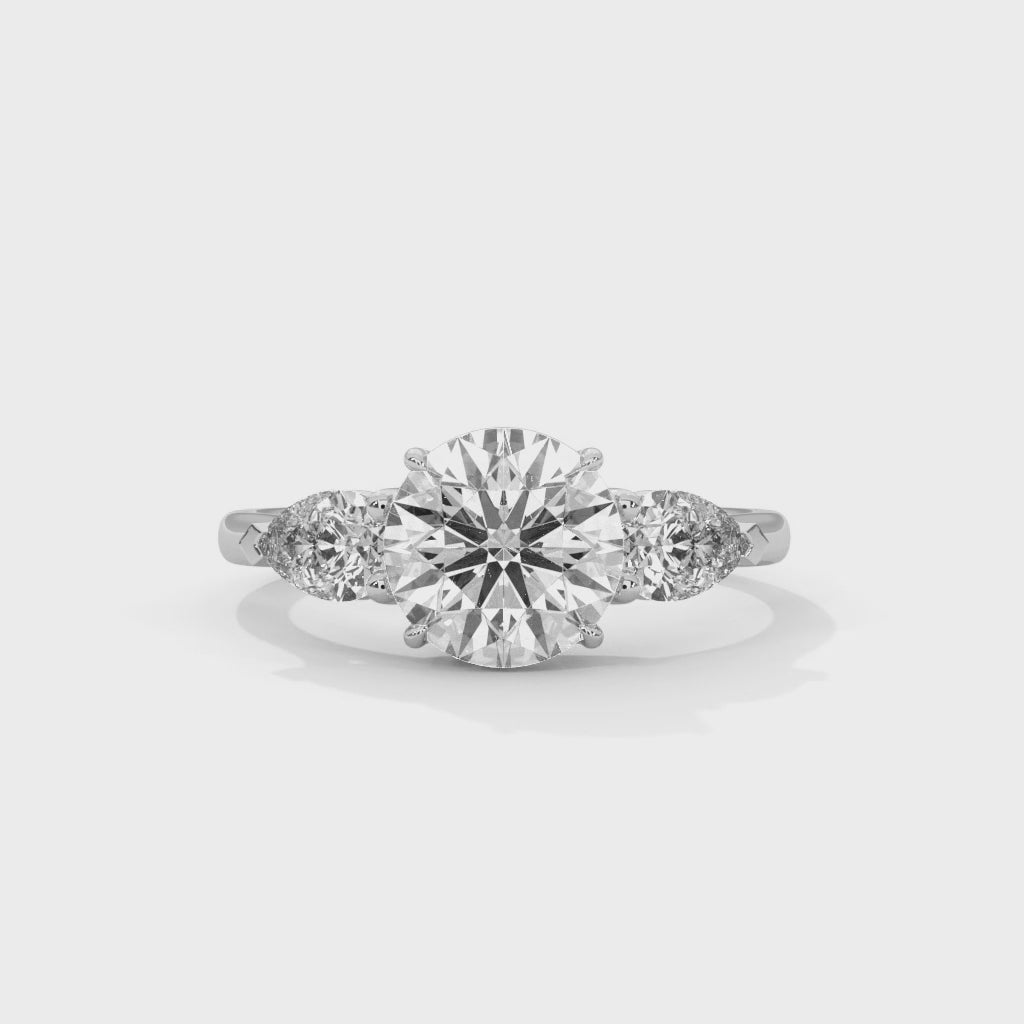Elegant Round Cut Three Stone Engagement Ring with Pear Side Stones