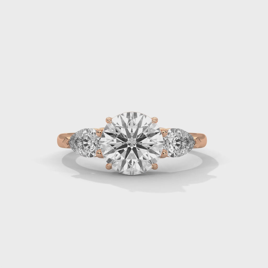 Elegant Round Cut Three Stone Engagement Ring with Pear Side Stones