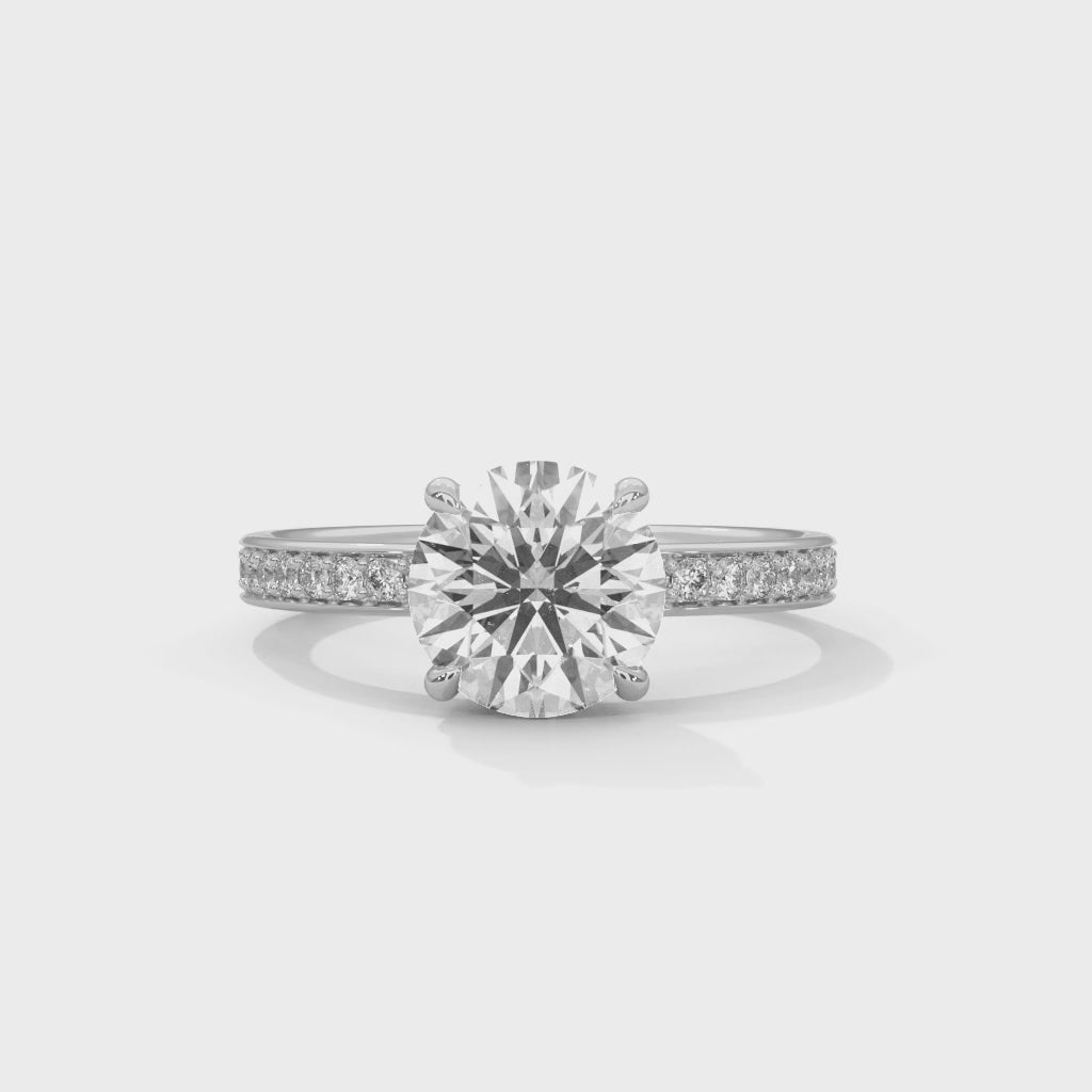 Luméra Grace Round Cut Solitaire Engagement Ring with Pavé Band