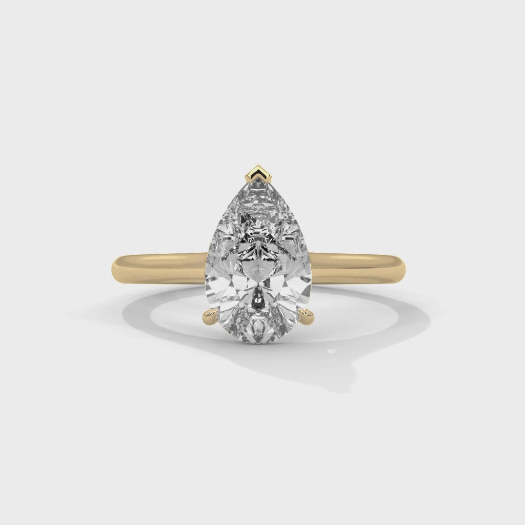 Élan Pear Cut Solitaire Engagement Ring with Knife-Edge Band