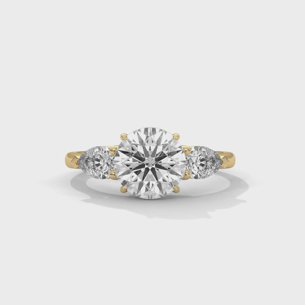Elegant Round Cut Three Stone Engagement Ring with Pear Side Stones