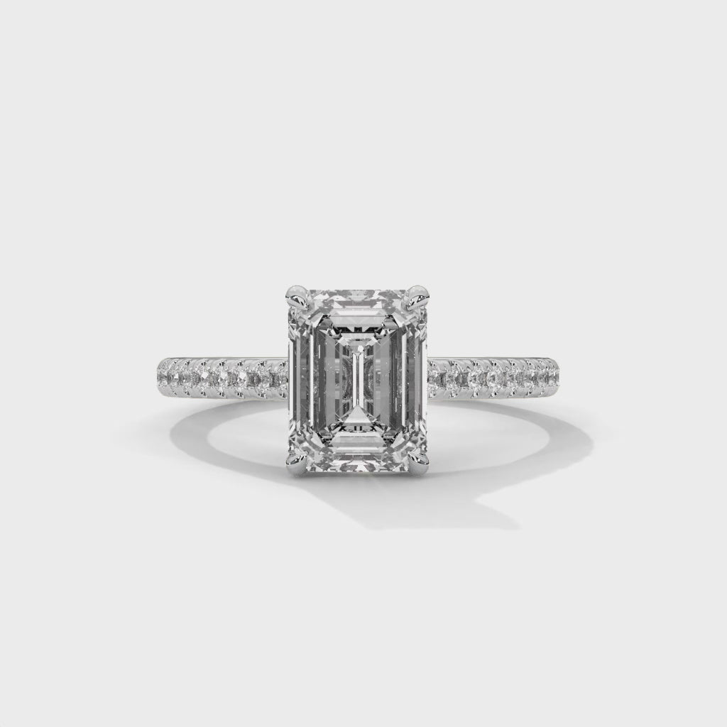 Regal Prism Emerald Cut Solitaire Engagement Ring with Pavé Band